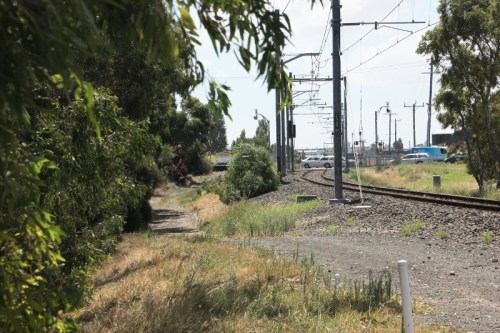 Approaching Camp Rd level crossing on the track